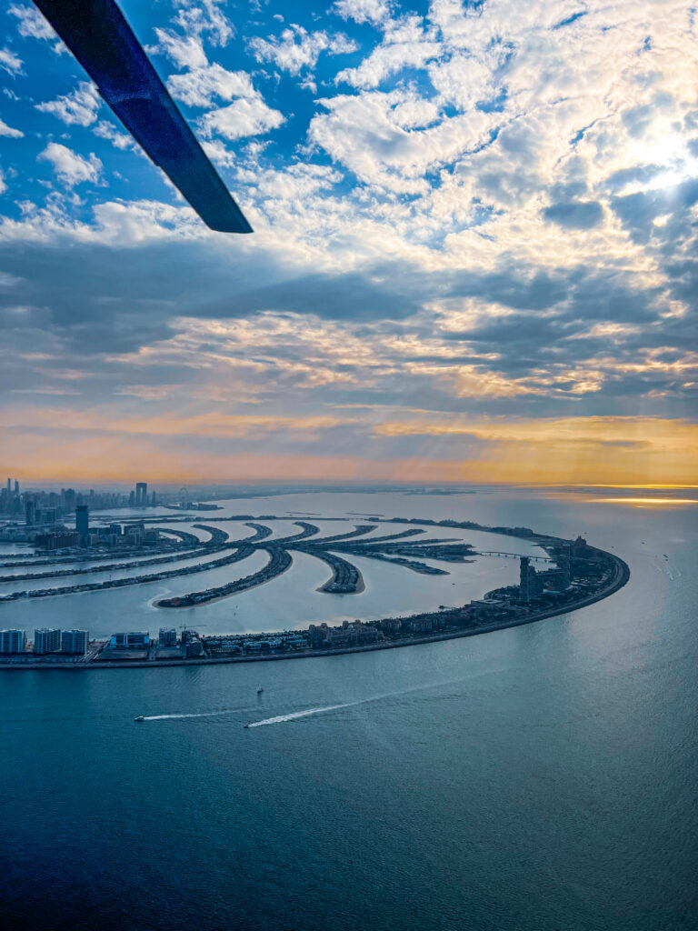 Scenic helicopter shot over Atlantis, The Palm with crystal-clear waters and palm-shaped island