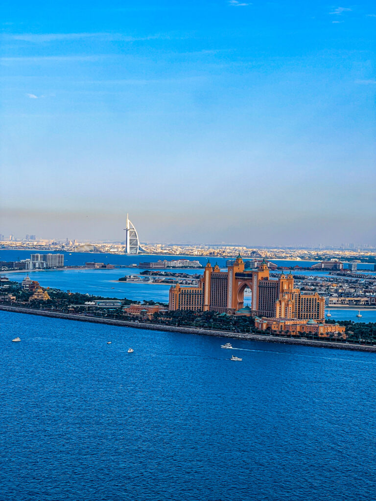 Scenic helicopter shot over Atlantis, The Palm with crystal-clear waters and palm-shaped island